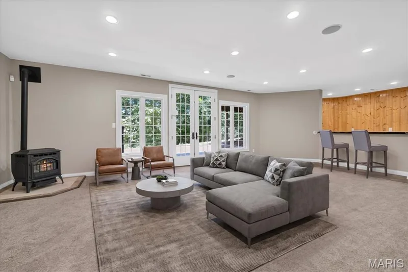 Lower level features  10-foot deep-pour ceilings, fresh paint, and brand-new carpeting! — 18517 Gredan Court, Wildwood, MO 63069