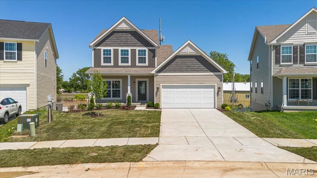 The Cortland elevation 2 by Consort Homes with 12x12 composite deck, 2 car garage and 8 ft walkout — 30 River Wind Drive, St Charles, MO 63301