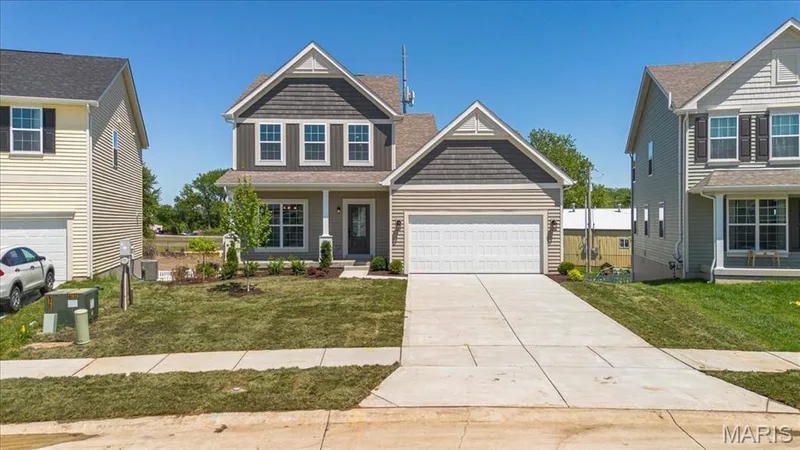 The Cortland elevation 2 by Consort Homes with 12x12 composite deck, 2 car garage and 8 ft walkout — 30 River Wind Drive, St Charles, MO 63301