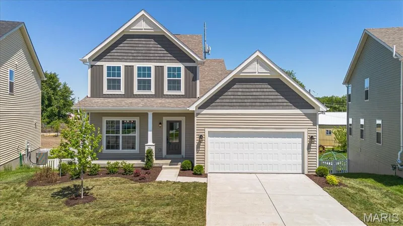 The Cortland elevation 2 by Consort Homes with 12x12 composite deck, 2 car garage and 8 ft walkout — 30 River Wind Drive, St Charles, MO 63301