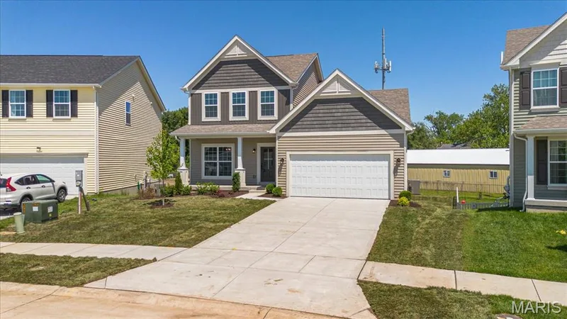 The Cortland elevation 2 by Consort Homes with 12x12 composite deck, 2 car garage and 8 ft walkout — 30 River Wind Drive, St Charles, MO 63301