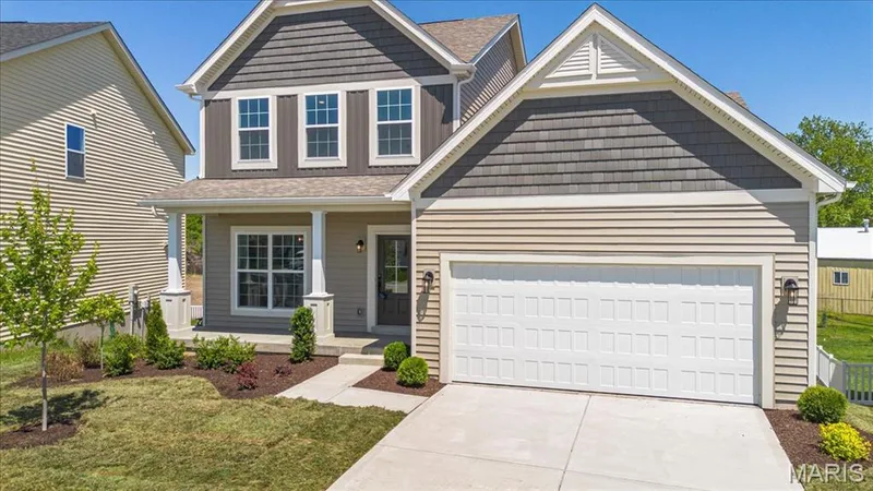 The Cortland elevation 2 by Consort Homes with 12x12 composite deck, 2 car garage and 8 ft walkout — 30 River Wind Drive, St Charles, MO 63301