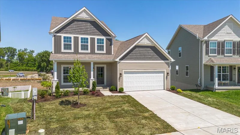 The Cortland elevation 2 by Consort Homes with 12x12 composite deck, 2 car garage and 8 ft walkout — 30 River Wind Drive, St Charles, MO 63301