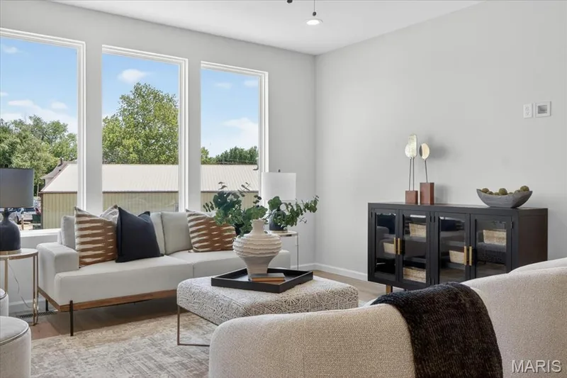 Family room view with window wall and ceiling fan — 30 River Wind Drive, St Charles, MO 63301