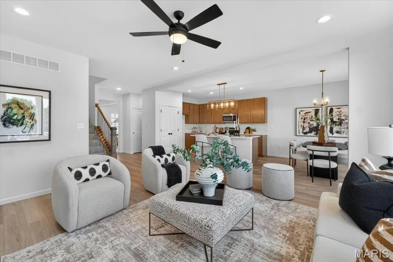 Family room view with window wall and ceiling fan — 30 River Wind Drive, St Charles, MO 63301