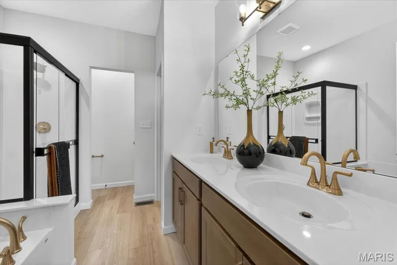 Primary bathroom with shower and tub — 30 River Wind Drive, St Charles, MO 63301