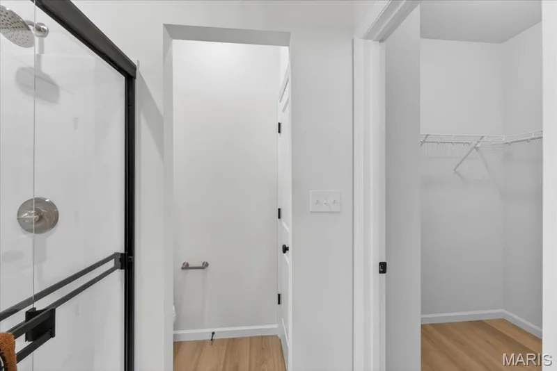 Primary bathroom and walk-in closet — 30 River Wind Drive, St Charles, MO 63301