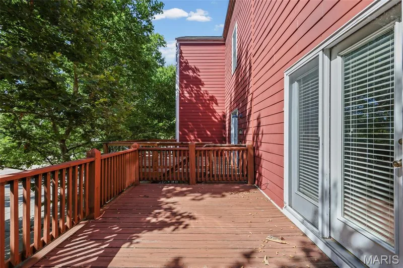Expansive outdoor decking with a wood railing system — 3245 Domain Street, St Charles, MO 63301
