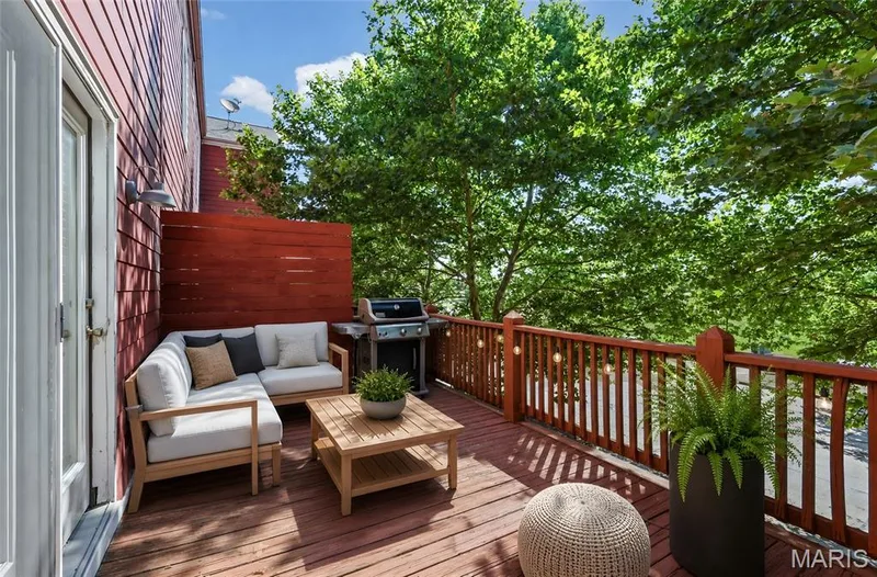 Expansive deck with wood flooring and a wooden privacy screen — 3245 Domain Street, St Charles, MO 63301