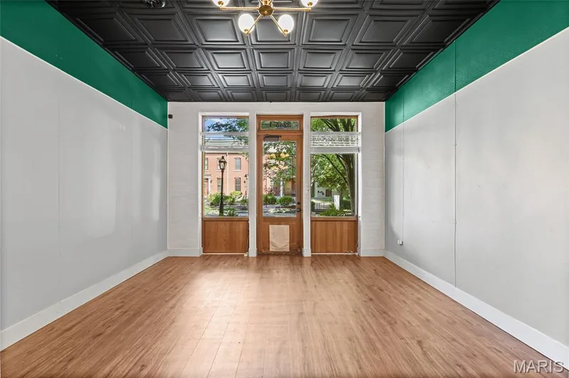 Wood-finish flooring with a decorative tin-tile ceiling — 3245 Domain Street, St Charles, MO 63301