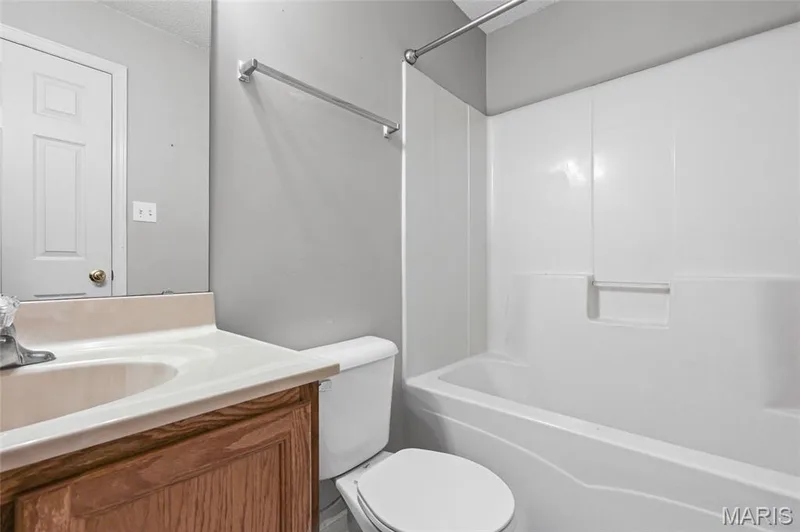 Integrated bathtub and shower combination with white surround — 3245 Domain Street, St Charles, MO 63301