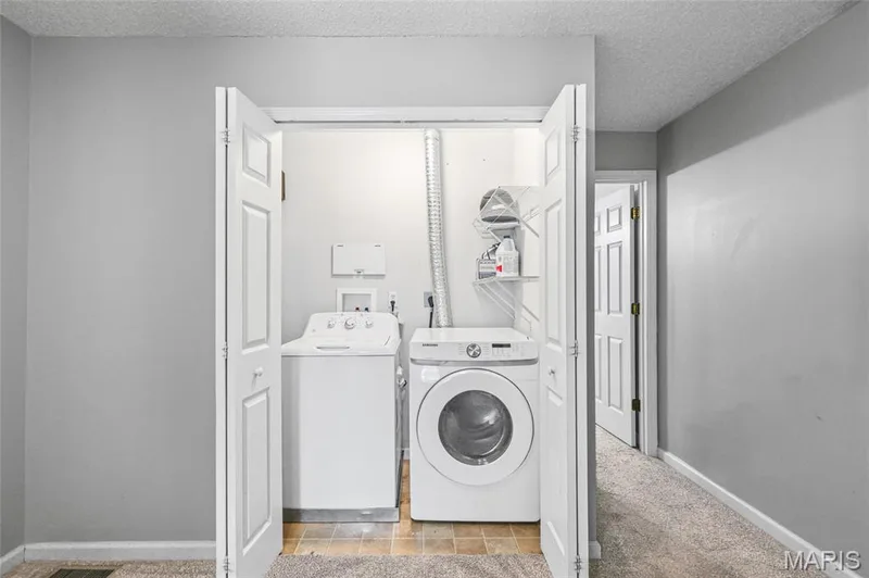 Dedicated laundry area with bi-fold doors — 3245 Domain Street, St Charles, MO 63301