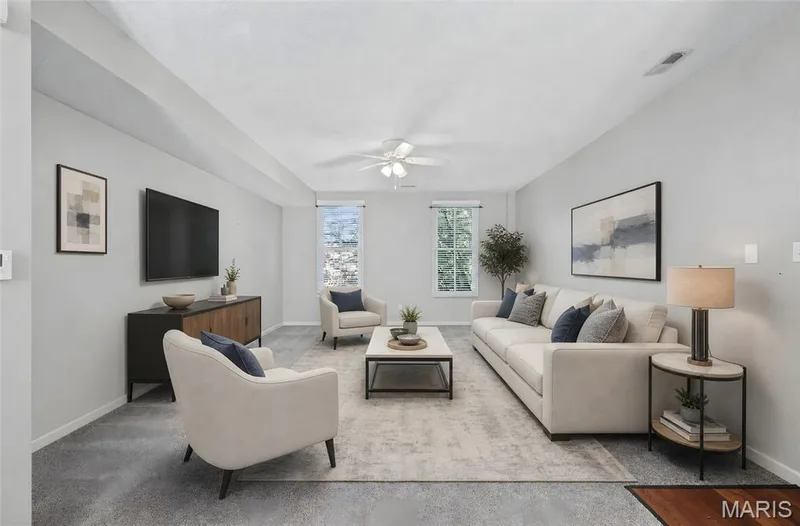 Spacious room featuring light gray walls, two windows, recessed lighting, and a ceiling fan — 3245 Domain Street, St Charles, MO 63301