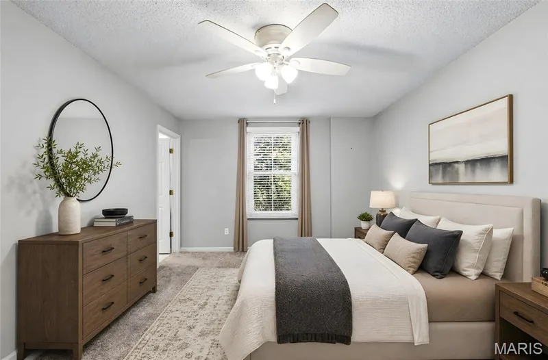 Ceiling fan with light kit, single window with blinds, carpeted flooring, and light-toned wall paint — 3245 Domain Street, St Charles, MO 63301