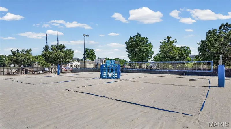 Dual sand volleyball courts with blue nets and posts — 3245 Domain Street, St Charles, MO 63301