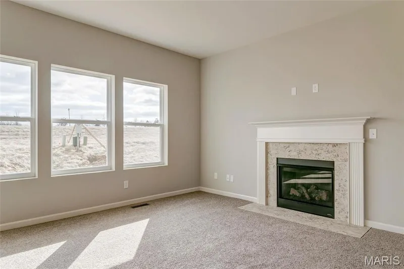 Great Room with fireplace and ample light. — 0 Sheridan @ Harvest, O'Fallon, MO 63385