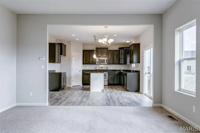 View from Great Room looking into spacious kitchen. — 0 Sheridan @ Harvest, O'Fallon, MO 63385
