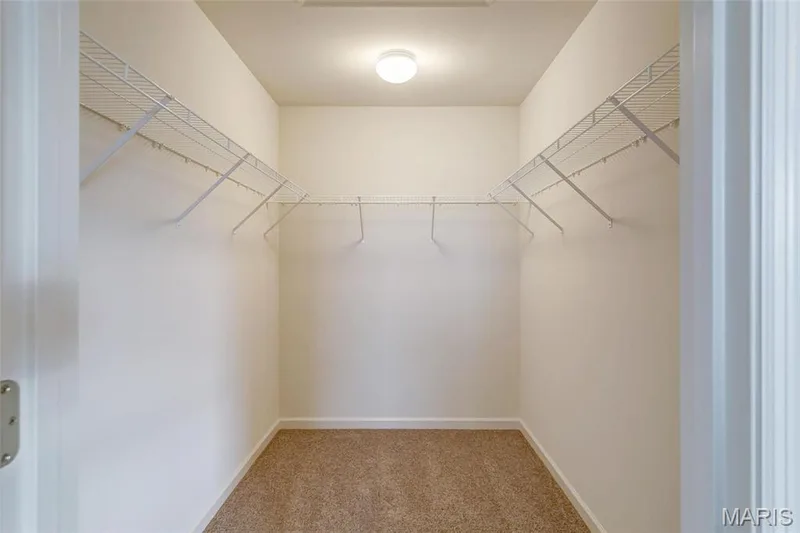 Primary Suite walk in closet with wire shelving. — 0 Sheridan @ Harvest, O'Fallon, MO 63385