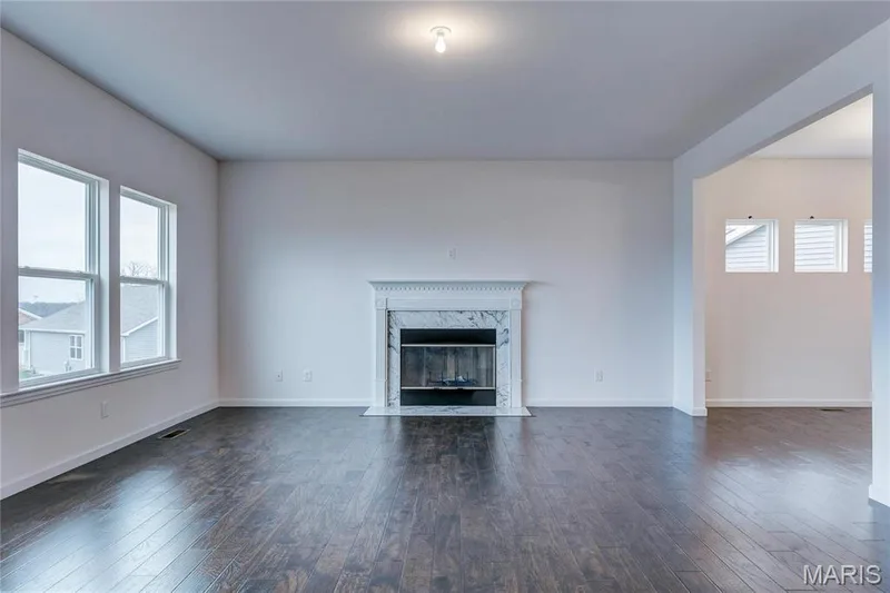 Great Room with fireplace and natural light. — 0 Stamford @ Harvest, O'Fallon, MO 63385