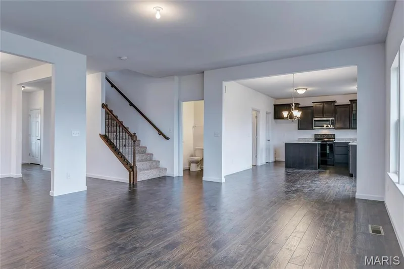 Great Room view into kitchen and stairs to 2nd floor — 0 Stamford @ Harvest, O'Fallon, MO 63385