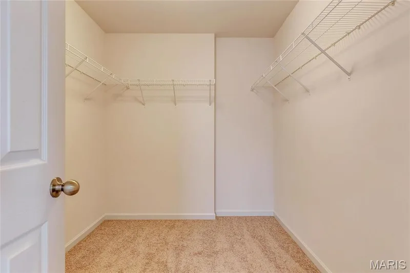 Primary Bedroom walk in closet with wire shelving — 0 Stamford @ Harvest, O'Fallon, MO 63385