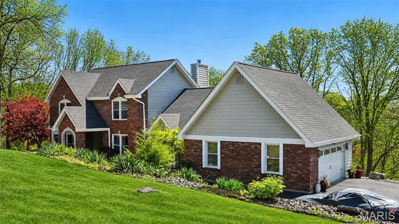 Brick and siding exterior with multi-pitch roofing — 1553 Ridge Road, Wildwood, MO 63021