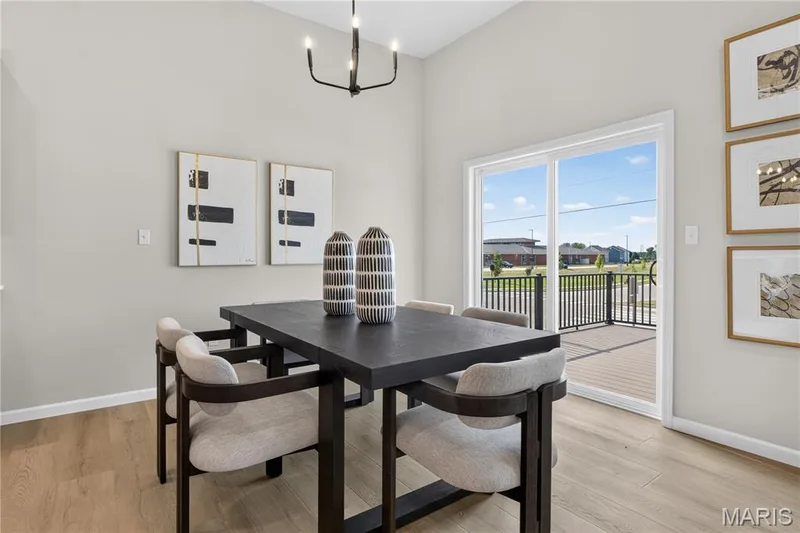 Breakfast area with view of sliding door to deck. — 106 River Wind Drive, St Charles, MO 63301