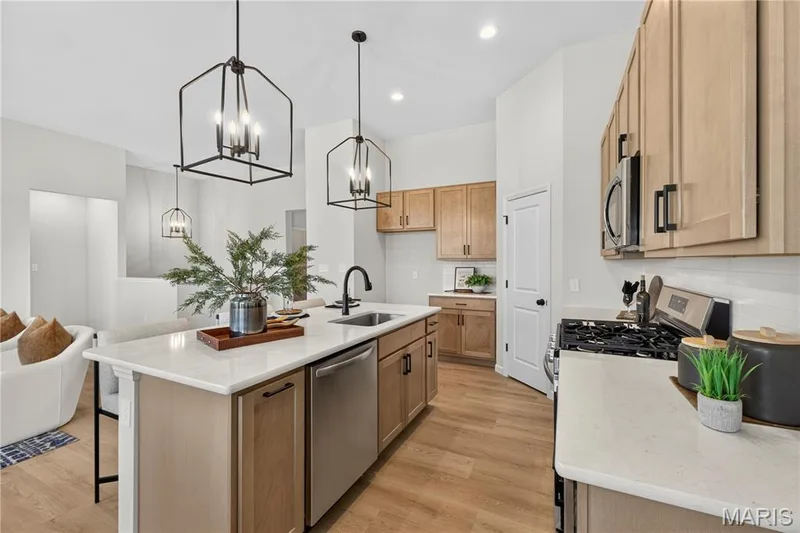 View of kitchen with island. — 106 River Wind Drive, St Charles, MO 63301