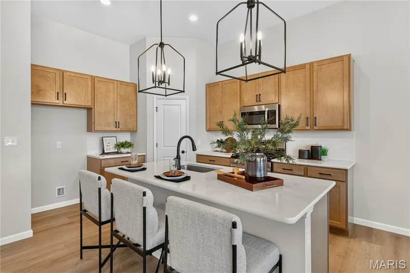 View of kitchen with island. — 106 River Wind Drive, St Charles, MO 63301