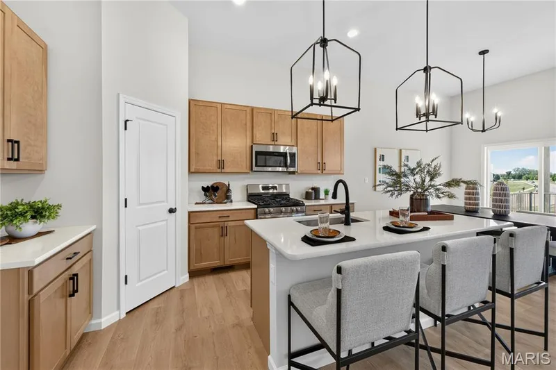 View of kitchen with island. — 106 River Wind Drive, St Charles, MO 63301