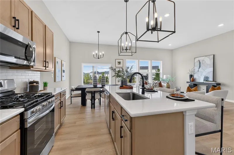 View of kitchen with island. — 106 River Wind Drive, St Charles, MO 63301