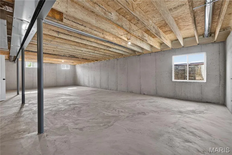 View of basement and egress window. — 106 River Wind Drive, St Charles, MO 63301