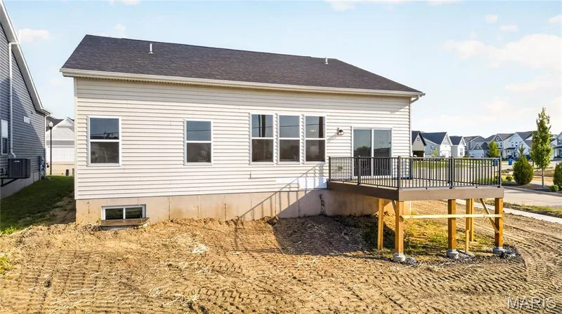 Rear exterior with view of deck. — 106 River Wind Drive, St Charles, MO 63301