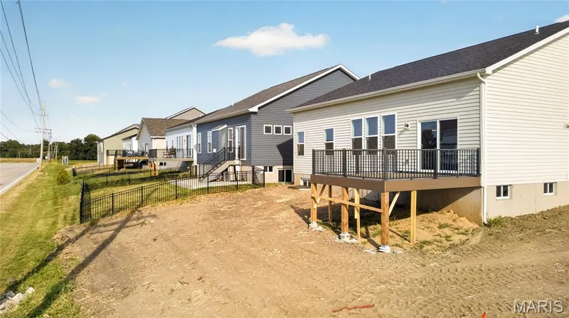 Rear exterior with view of deck. — 106 River Wind Drive, St Charles, MO 63301