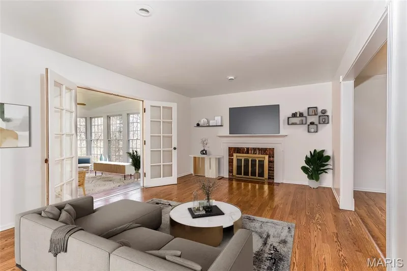 Family room with wood-burning fireplace. Virtually staged. — 250 Brixham Drive, Chesterfield, MO 63017