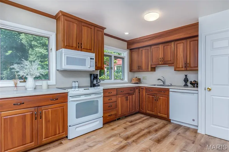 Updated kitchen with new luxury vinyl flooring and lighting. — 250 Brixham Drive, Chesterfield, MO 63017