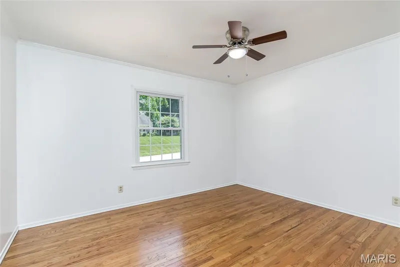 Bedroom #2 with gleaming hardwood floors and new ceiling fan. — 250 Brixham Drive, Chesterfield, MO 63017