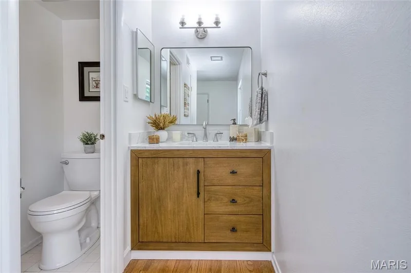 Beautiful new floating vanity, faucet, lighting and fixtures. — 250 Brixham Drive, Chesterfield, MO 63017