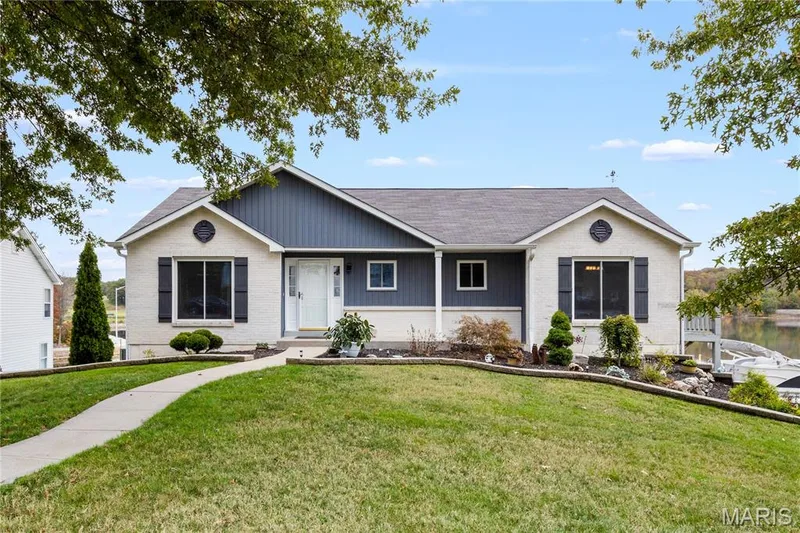 Ranch-style house with a front lawn, brick siding, and a shingled roof — 10107 Greenbriar Court, Foristell, MO 63348