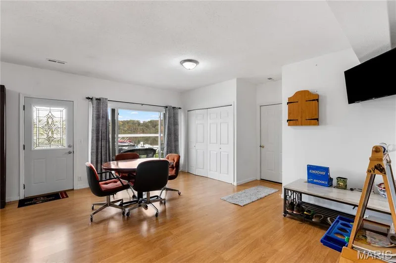 Office area featuring light wood-type flooring and a textured ceiling — 10107 Greenbriar Court, Foristell, MO 63348