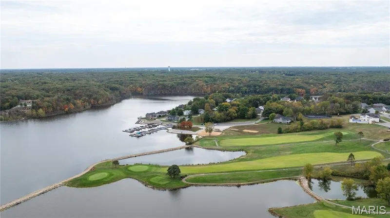 Aerial view of a large body of water and a local golf course — 10107 Greenbriar Court, Foristell, MO 63348