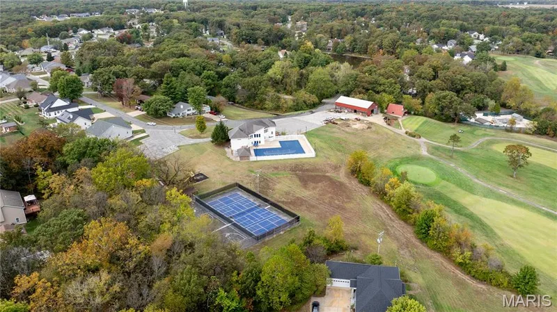 Aerial perspective of suburban area with a local golf course — 10107 Greenbriar Court, Foristell, MO 63348