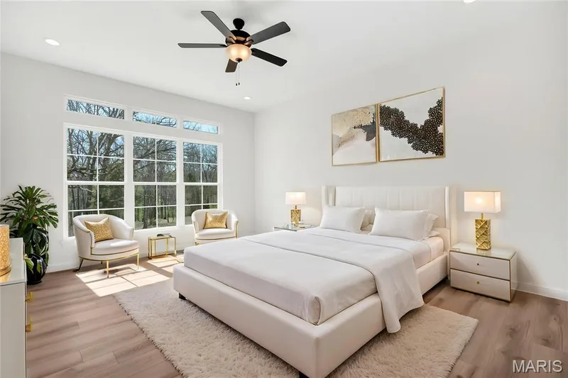Primary suite with triple window, transoms and LVP flooring. (Virtually staged photo shown) — 308 Schaper Estates Xing, Foristell, MO 63348