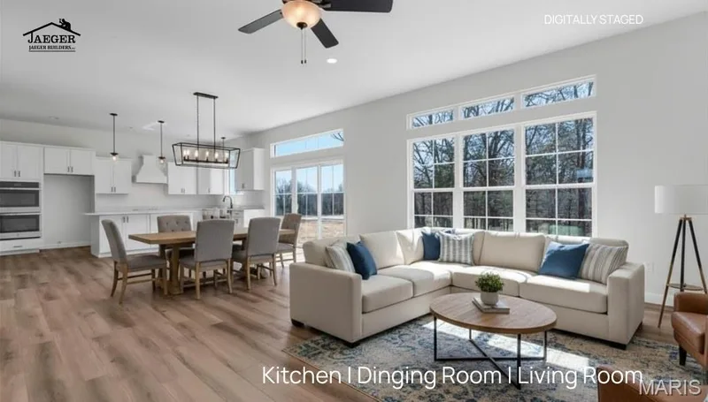Open Floor plan with tons of natural lighting. The Sycamore is 2097 sq ft on the main floor. (Virtually staged photo) — 308 Schaper Estates Xing, Foristell, MO 63348