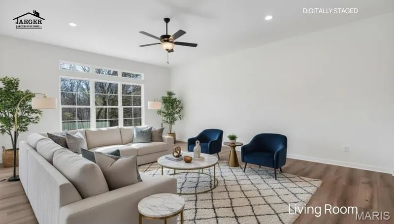 10 ft ceilings, transoms in back and triple window in the great room for natural lighting and taking in the beautiful view in back on this 3.05 acre lot. (Virtually staged photo) — 308 Schaper Estates Xing, Foristell, MO 63348