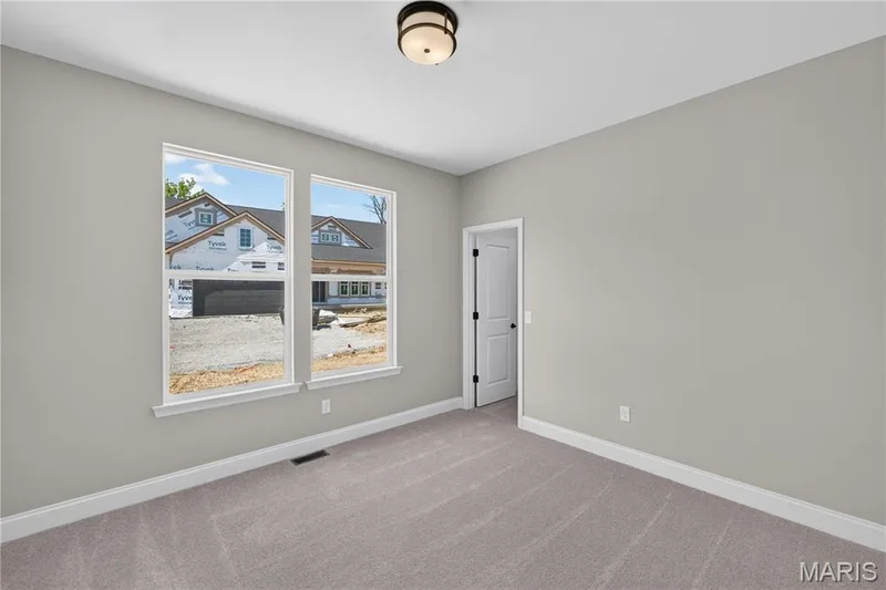 Bedroom 3 with light gray walls, plush gray carpeting, Walk-in closet — 126 Royal Troon Drive, Dardenne Prairie, MO 63368
