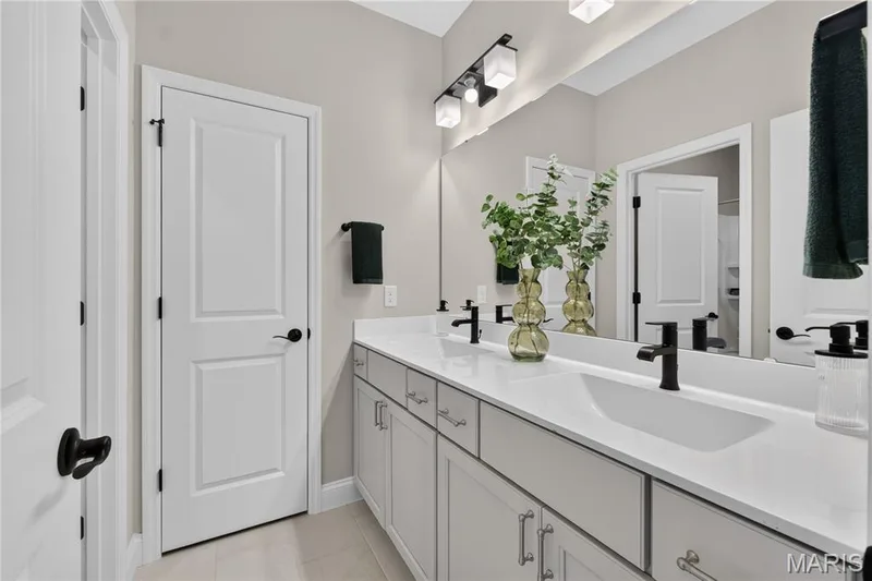 full bathroom with dual vanity with integrated sinks, white countertops, light gray cabinetry — 126 Royal Troon Drive, Dardenne Prairie, MO 63368