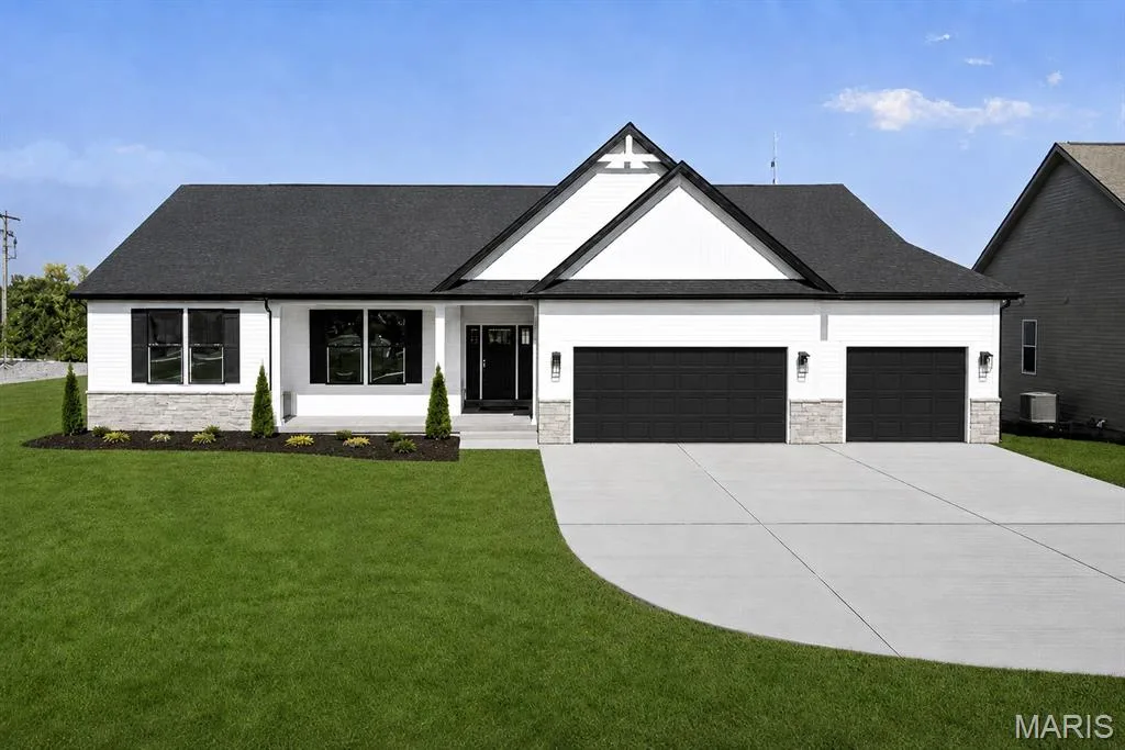 Modern ranch-style residence featuring a striking two-tone exterior with white board-and-batten siding, dark architectural shingles, and a prominent gabled roofline — 126 Royal Troon Drive, Dardenne Prairie, MO 63368