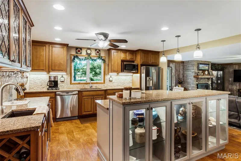 Updated kitchen has beautiful glass front cabinets — 51 Nordic Lane, Defiance, MO 63341