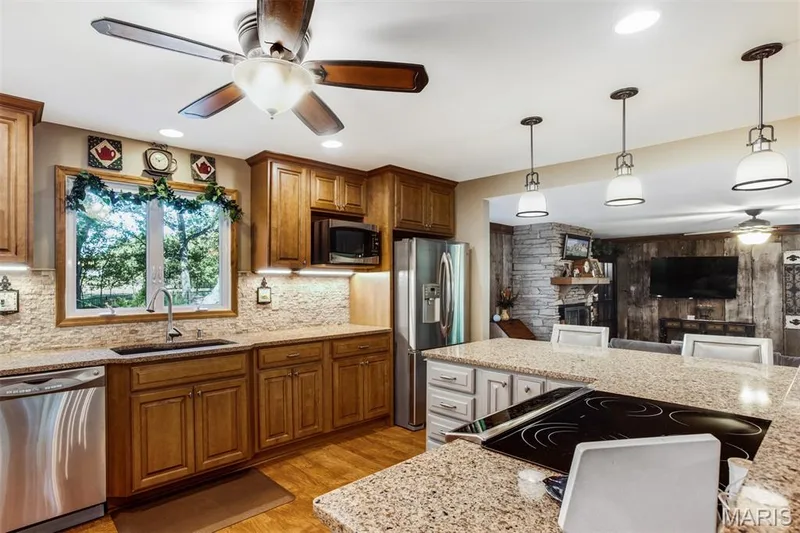 Quartz counters and stone backsplash — 51 Nordic Lane, Defiance, MO 63341